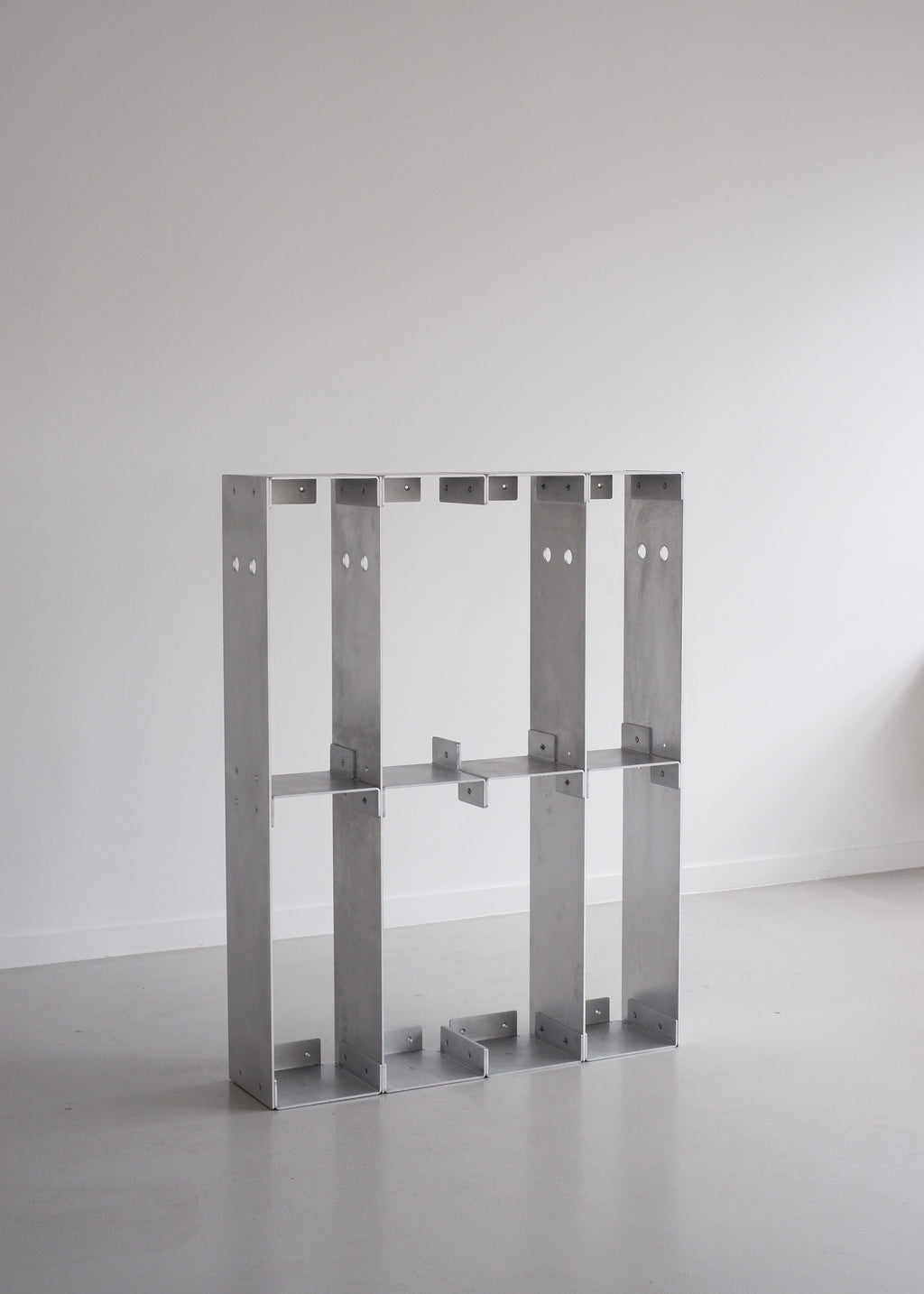 Metal frame structure on a plain background