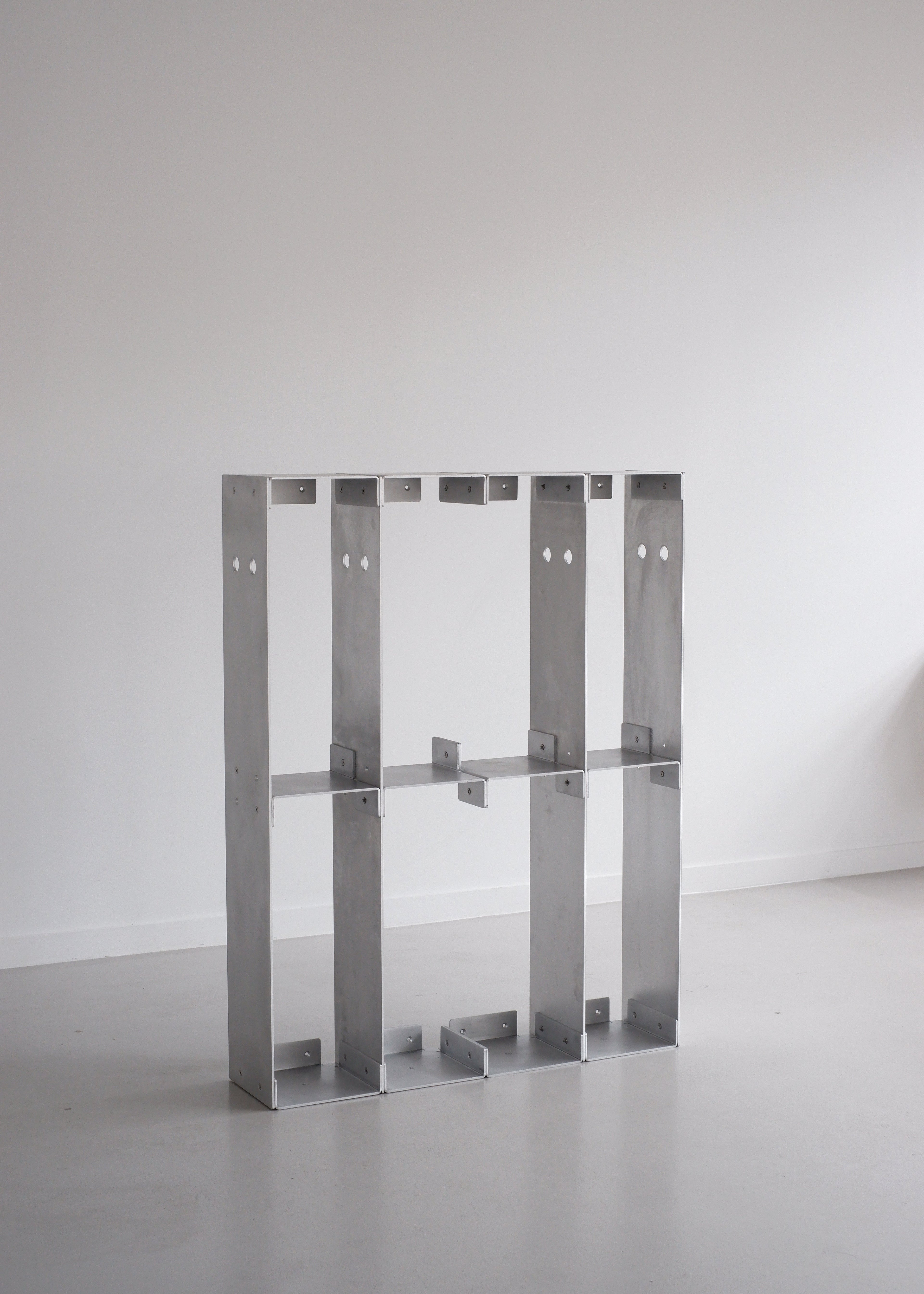 Metal frame structure on a plain background