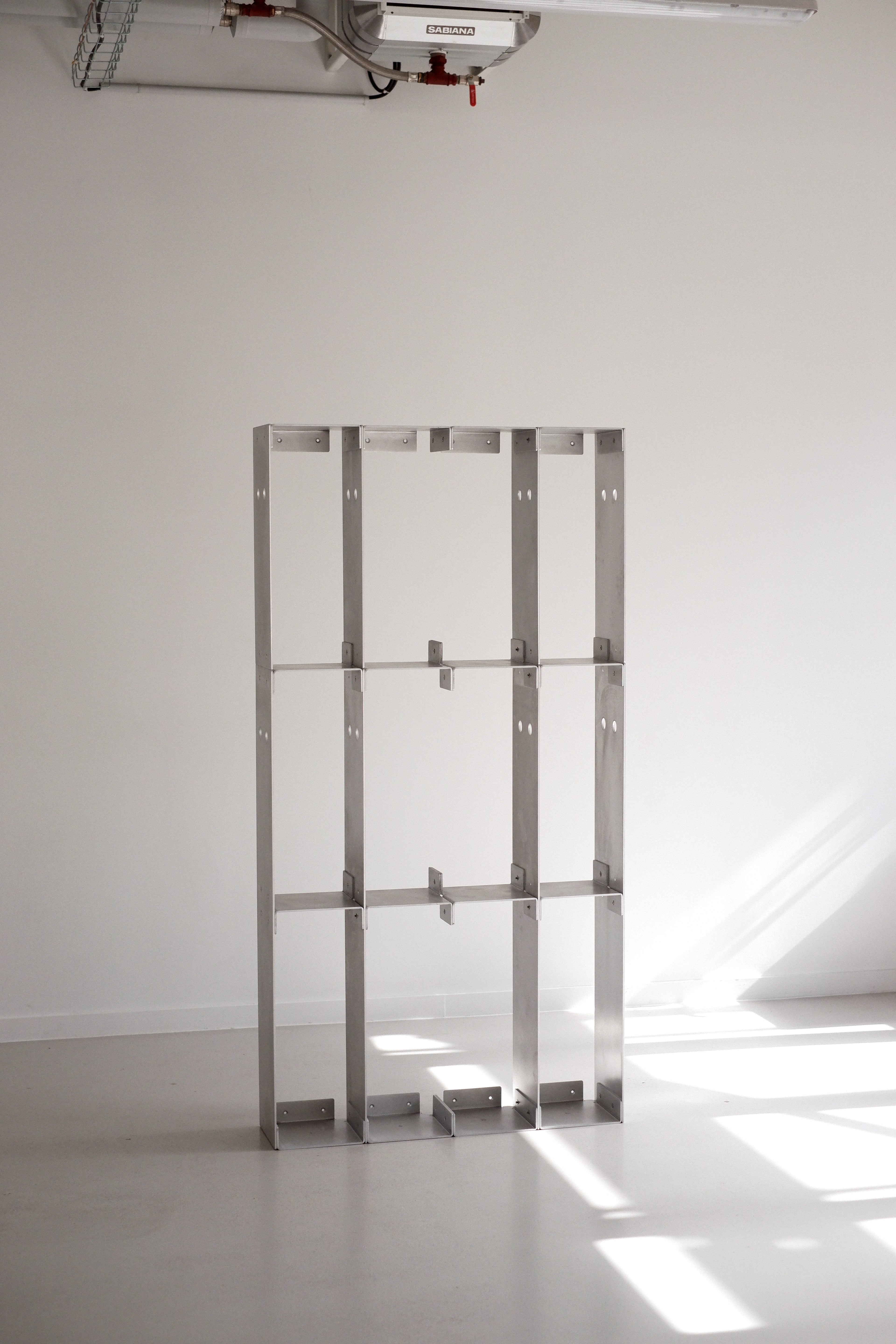 Metal shelving unit against a white wall