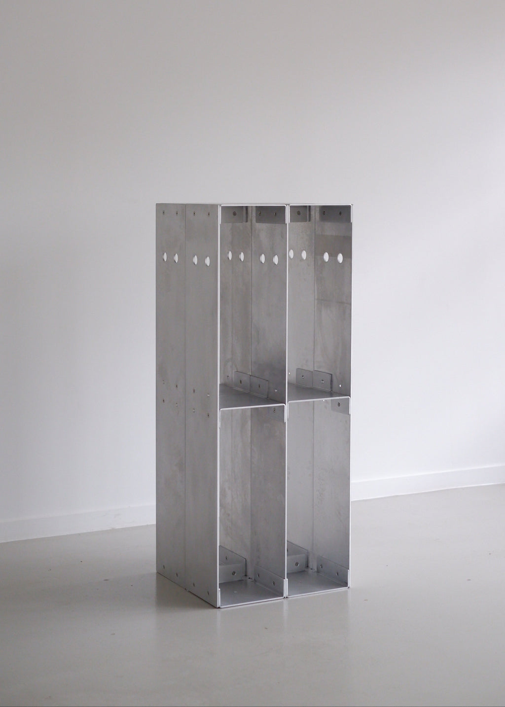 Metal shelf with polish-like finish on a white background