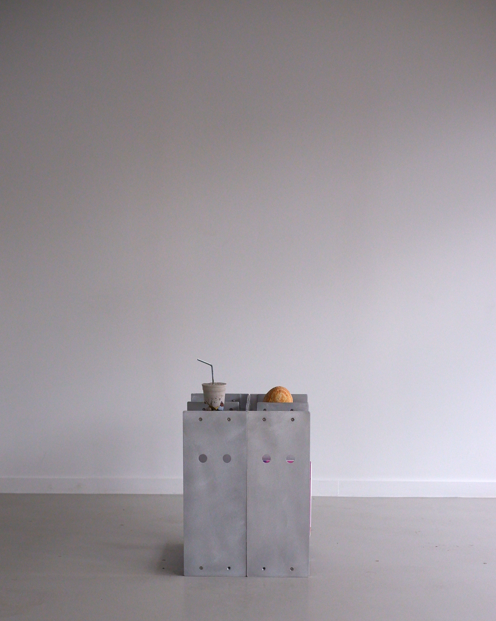 aluminum side table on a plain background